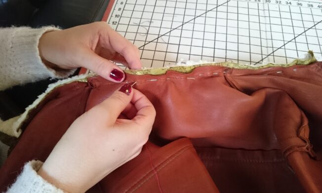 Pinning the neck area, with the new collar inserted between jacket and lining